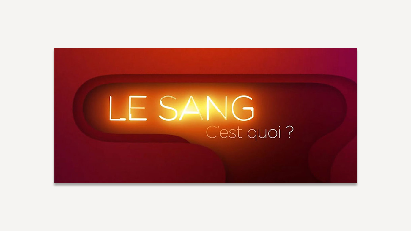 Titre stylisé « Le sang, c'est quoi ? » en effet lumineux façon néon sur fond dégradé rouge et orange.